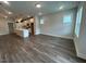 Spacious living area with hardwood floors, recessed lighting, and an open floor plan to the kitchen at 502 Yeowell Dr, Chapel Hill, NC 27514