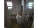 Bathroom featuring a single sink vanity and glass shower door, needing renovation at 505 S 15Th St, Erwin, NC 28339