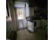 Kitchen with outdated cabinets, appliances, and flooring, indicating required renovations at 505 S 15Th St, Erwin, NC 28339