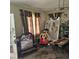 Spacious living room featuring large windows and a vintage mirror at 505 S 15Th St, Erwin, NC 28339
