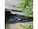 Damaged roof covered with black plastic, suggesting immediate need for repair at 505 S 15Th St, Erwin, NC 28339