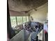 Room filled with clutter including bikes and an aquarium, needing renovation at 505 S 15Th St, Erwin, NC 28339