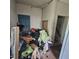 Unorganized room featuring blue door and assorted items at 505 S 15Th St, Erwin, NC 28339