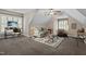 Bonus room featuring two windows and a couch at 512 Belmont Cir, Wake Forest, NC 27587