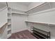 Walk-in closet with shelving and wood rods at 512 Belmont Cir, Wake Forest, NC 27587
