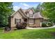 A charming two-story home with stone accents and professionally landscaped yard at 512 Belmont Cir, Wake Forest, NC 27587