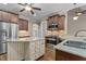 Spacious kitchen featuring stainless steel appliances, granite countertops, island with storage, and hardwood floors at 512 Belmont Cir, Wake Forest, NC 27587