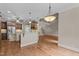 Open-concept kitchen and living area with hardwood floors, stainless appliances, and lots of space at 512 Belmont Cir, Wake Forest, NC 27587