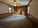 Cozy bedroom with wood paneled walls, built-in shelving, and plush carpet at 520 Charlotte Ave, Rocky Mount, NC 27804