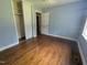 Cozy bedroom with hardwood floors, a closet, and light blue walls at 520 Charlotte Ave, Rocky Mount, NC 27804