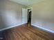 Light-filled bedroom featuring hardwood floors and neutral walls at 520 Charlotte Ave, Rocky Mount, NC 27804