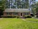 Charming brick home with well-manicured lawn and mature trees at 520 Charlotte Ave, Rocky Mount, NC 27804