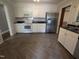 Modern kitchen with stainless steel appliances and herringbone-patterned floors at 520 Charlotte Ave, Rocky Mount, NC 27804