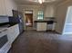 Bright kitchen featuring stainless steel appliances and herringbone flooring at 520 Charlotte Ave, Rocky Mount, NC 27804