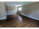 Spacious living room with hardwood floors, crown molding and natural light at 520 Charlotte Ave, Rocky Mount, NC 27804
