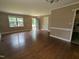 Inviting living room featuring gleaming hardwood floors and neutral paint at 520 Charlotte Ave, Rocky Mount, NC 27804
