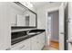 This bathroom features a vanity with granite counters and tiled floors at 532 Joe Collins Rd, Lillington, NC 27546
