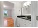 This bathroom features a vanity with granite counters and tiled floors at 532 Joe Collins Rd, Lillington, NC 27546