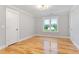 This bedroom has hardwood floors, recessed lighting, and a large window with a view at 532 Joe Collins Rd, Lillington, NC 27546