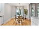 Inviting dining room with modern chandelier, natural light, and hardwood floors at 532 Joe Collins Rd, Lillington, NC 27546