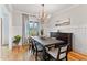 Elegant dining room featuring a modern chandelier, stylish decor, and lots of natural light at 532 Joe Collins Rd, Lillington, NC 27546