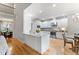 Modern kitchen featuring white cabinetry, stainless steel appliances, and a marble countertop island at 532 Joe Collins Rd, Lillington, NC 27546