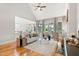 Bright living area features vaulted ceilings, fireplace, hardwood floors, and an open flow to the kitchen at 532 Joe Collins Rd, Lillington, NC 27546
