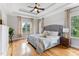 Spacious main bedroom features tray ceilings, hardwood floors, and natural light at 532 Joe Collins Rd, Lillington, NC 27546