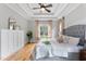 Bright main bedroom boasts tray ceiling, ceiling fan, wood floors, and lots of natural light at 532 Joe Collins Rd, Lillington, NC 27546