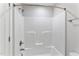 All white shower with adjustable shower head and built in storage at 532 Joe Collins Rd, Lillington, NC 27546
