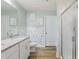 Well-lit bathroom with a double vanity, granite countertops, and a glass-enclosed shower at 6102 Burning Tree Cir, Sanford, NC 27332