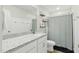 Bright bathroom featuring a granite countertop, shower, and a neutral color scheme, creating a soothing and clean aesthetic at 6102 Burning Tree Cir, Sanford, NC 27332