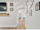 Hallway with decor leading to the bedroom and bathroom with great lighting at 6102 Burning Tree Cir, Sanford, NC 27332
