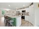 Modern kitchen with granite countertops, stainless steel appliances, and breakfast bar seating at 6102 Burning Tree Cir, Sanford, NC 27332
