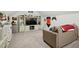 Spacious living room designed for entertainment, complete with a large entertainment center and comfortable seating at 6102 Burning Tree Cir, Sanford, NC 27332