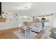 Open-concept living room with view of kitchen and dining area, perfect for entertaining at 6102 Burning Tree Cir, Sanford, NC 27332
