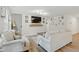 Cozy living room with large TV mounted above mantel and stylish decor at 6102 Burning Tree Cir, Sanford, NC 27332