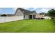 Backyard with lush lawn, a screen porch, grill and privacy fence at 71 Sanibel St, Clayton, NC 27520