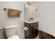 Cozy bathroom featuring a vanity with storage and a decorative mirror with lighting at 71 Sanibel St, Clayton, NC 27520