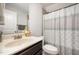 Bathroom featuring a vanity, mirror and shower with patterned shower curtain at 71 Sanibel St, Clayton, NC 27520