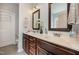 Bathroom with a double sink vanity, dark wood cabinets, and ample counter space and decorative accents at 71 Sanibel St, Clayton, NC 27520