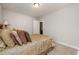 Inviting bedroom featuring carpet floors and an ensuite bath at 71 Sanibel St, Clayton, NC 27520