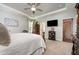 Spacious bedroom featuring neutral tones, carpet flooring, a ceiling fan, and ample natural light at 71 Sanibel St, Clayton, NC 27520