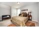 Comfortable bedroom with a patterned bedspread and classic furnishings, perfect for relaxation at 71 Sanibel St, Clayton, NC 27520