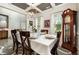 Elegant dining room featuring a large table setting, decorative lighting, and large windows with natural light at 71 Sanibel St, Clayton, NC 27520