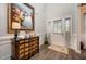 Inviting entryway featuring hardwood floors, elegant decor, and a front door with sidelights for added natural light at 71 Sanibel St, Clayton, NC 27520