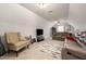 Relaxing living room with plush seating, TV and patterned area rug at 71 Sanibel St, Clayton, NC 27520
