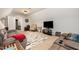 Spacious living room with plush seating, a large TV, and neutral decor at 71 Sanibel St, Clayton, NC 27520