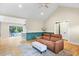 Open-concept living room features hardwood floors, neutral paint, and backyard access, ideal for modern living at 7132 Deer Brook St, Willow Springs, NC 27592