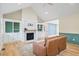 Bright living room boasts hardwood floors, built-in cabinets, a fireplace, and modern finishes throughout at 7132 Deer Brook St, Willow Springs, NC 27592